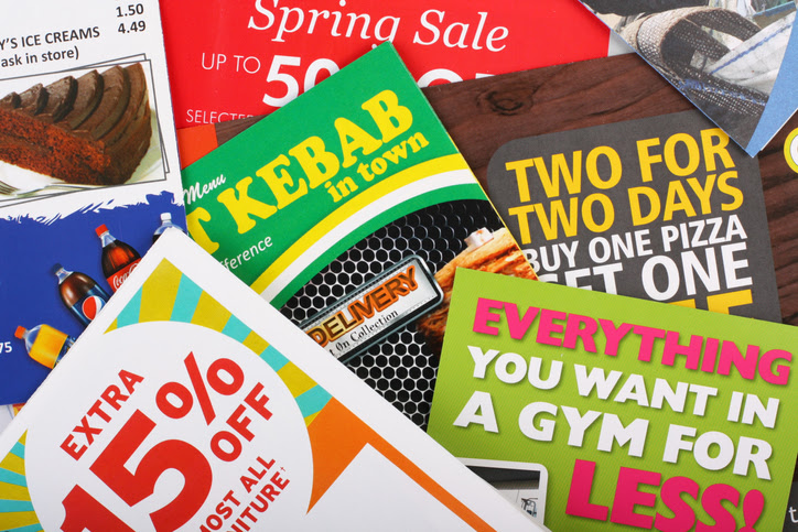 Bracknell, United Kingdom - April 3rd, 2011: Assorted flyers delivered to a private residence in the UK advertising fast food and drink, retail sales, gym membership and various special offers.